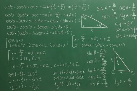 Many different math formulas written on green chalkboard Stock Photos