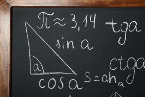 Many different math formulas written on chalkboard, closeup Stock Photos