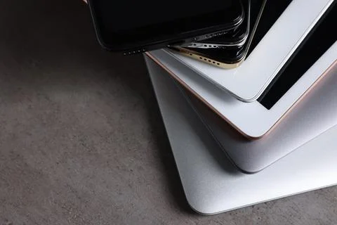 Many different modern gadgets on grey table, closeup. Space for text Foto stock