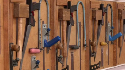 Many different old tools hanging on a barn wall. Stock-Footage 290065107