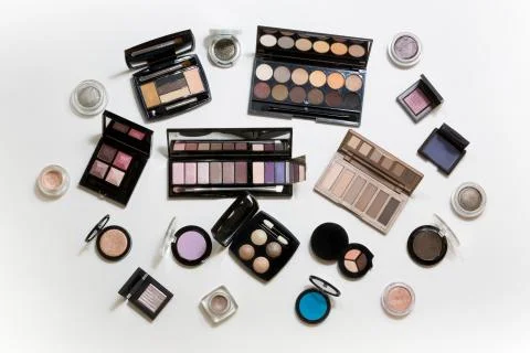 Many different palettes of eye shadow. Top view. Stock Photos