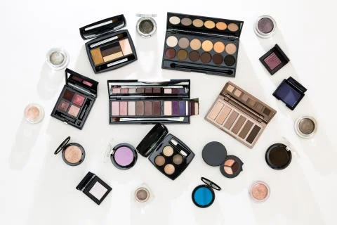 Many different palettes of eye shadow. Top view. Stock Photos