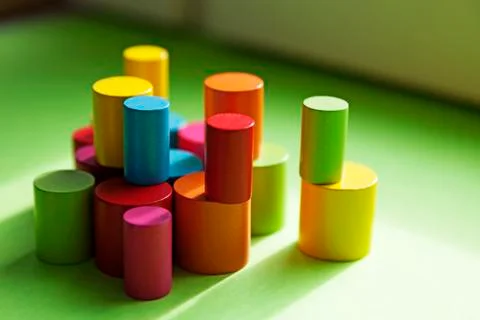 Many different round small colored wooden sticks stacked on each other Foto stock