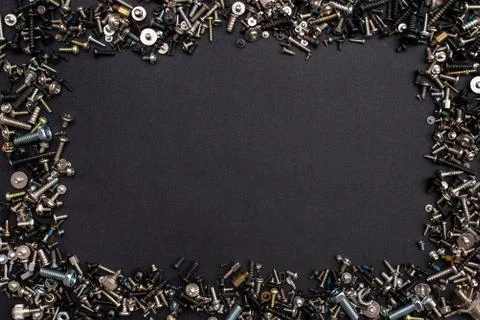 Many different screws and nuts of different sizes and colors.frame Stock Photos