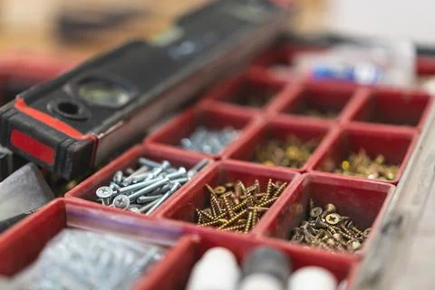 Many different screws in the  organizer of master for work Stock Photos