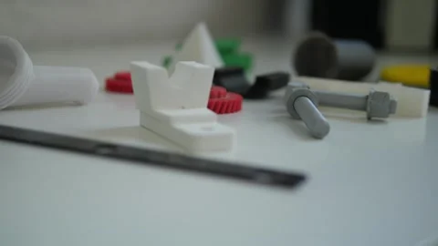 Many different shapes created on a 3D printer. 3D technology. Stock Footage 311151842