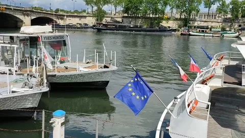 Many different ships on the Seine river near the bridge in Paris, France Stock Footage 154792245