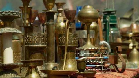 Many different size copper candlesticks Stock Photos