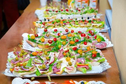Many different snacks on big plates Stock Photos