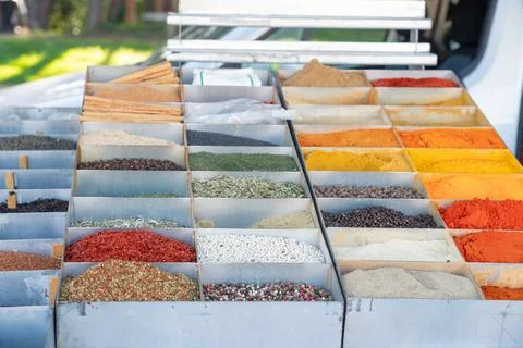 Many different spices in boxes on the counter of the weekend market Stock Photos