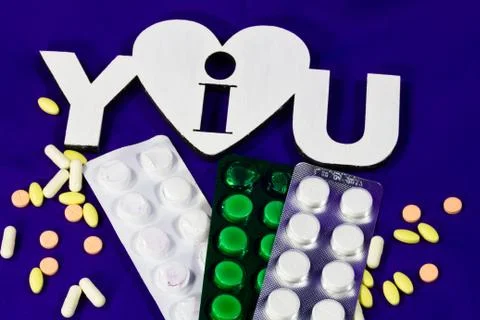Many different tablets and thermometer Stock Photos