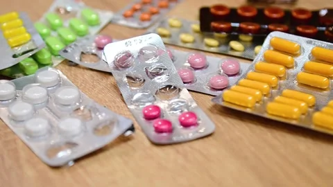 Many different tablets in blisters, medications Stock Footage 324700949