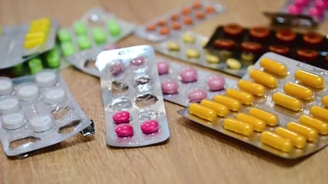 Many different tablets in blisters, medications Stock Footage 324700950