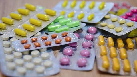 Many different tablets in blisters, medications Stock Footage 324701257