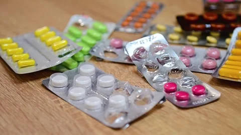Many different tablets in blisters, medications Stock Footage 324701334