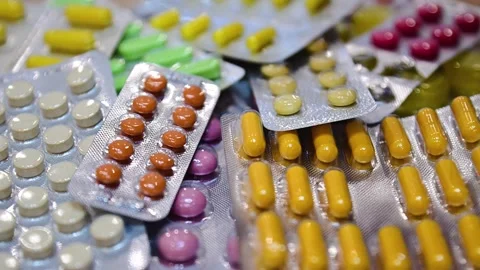 Many different tablets in blisters, medications Stock Footage 324701335