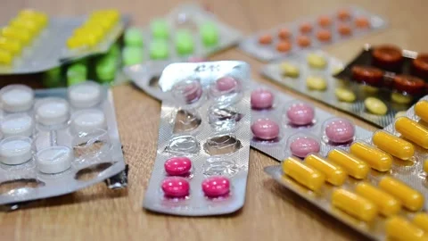 Many different tablets in blisters, medications Stock Footage 324701518