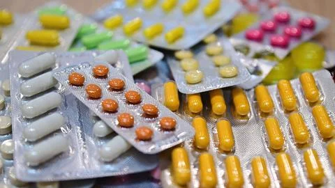 Many different tablets in blisters, medications Stock Photos