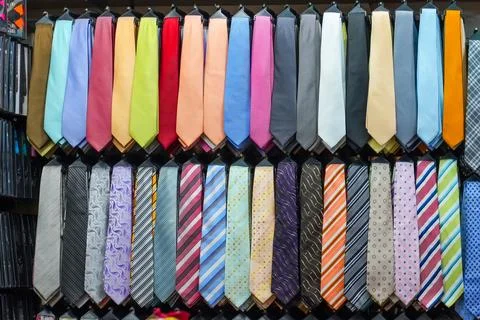 Many different ties of multi colors on display at the exhibition showcase. La Stock Photos
