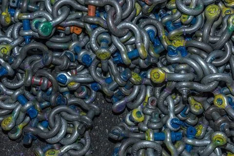 Many different types of used iron shackles Stock Photos