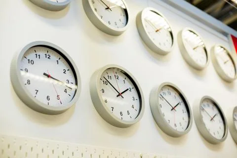 Many different wall clock on the wall. Clock shop.shopping time concept. Big Stock Photos