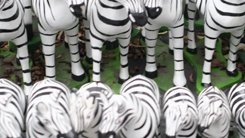Many different zebra figurines of different sizes for sale on the street   Stock Footage 138300459