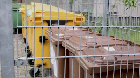 Many dirty garbage can outside in a row Stock-Footage 242990912