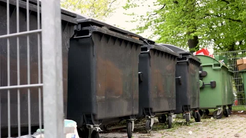 Many dirty garbage can outside in a row Stock-Footage 242990942