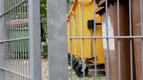 Many dirty garbage can outside in a row Stock-Footage 242990945