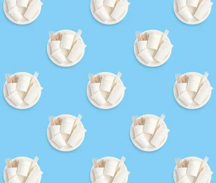 Many disposable paper tableware on turquoise background, flat lay. Seamless p Stock Photos