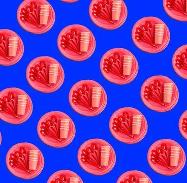 Many disposable tableware on blue background, flat lay. Seamless pattern desi Stock Photos