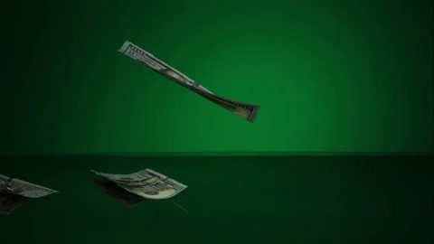 Many dollar bills falling on green surface Stock Footage 327051183