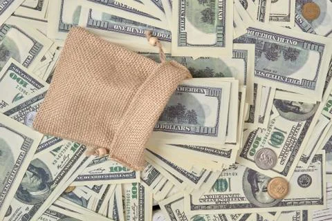 Many dollar bills in a sack. Stock Photos