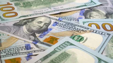 Many dollars are rotating. Spinning background of money. Hape of a cash turning. Stock Footage 94011297