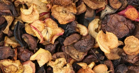Many dried fruit apples are scattered as a background Stock Footage 107827293