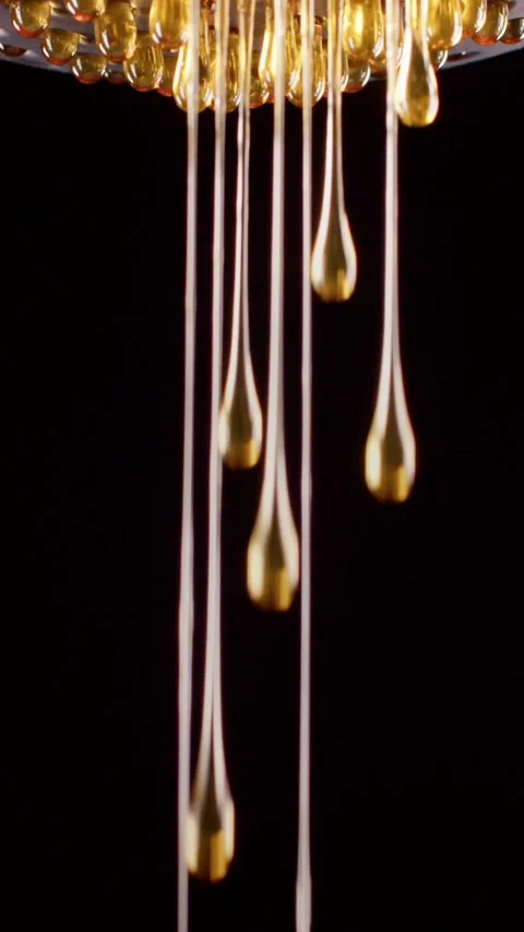 Many drops of honey on a black background 스톡 동영상 237705389