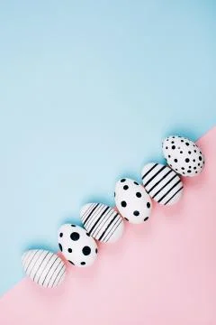 Many easter eggs on pink. Flat lay. Stock Photos