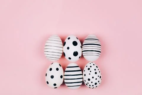 Many easter eggs on pink. Flat lay. Stock Photos