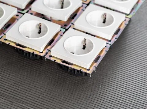 Many electrical sockets on a gray background, reliable high-quality sockets Fotos Stock