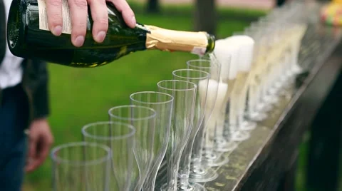Many elegant empty and half-empty wine glasses of wine or champagne on the Stock Footage 62796445