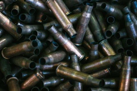 Many empty bullet shells, pile of used rifle cartridges 7.62 mm caliber, assa Stock Photos