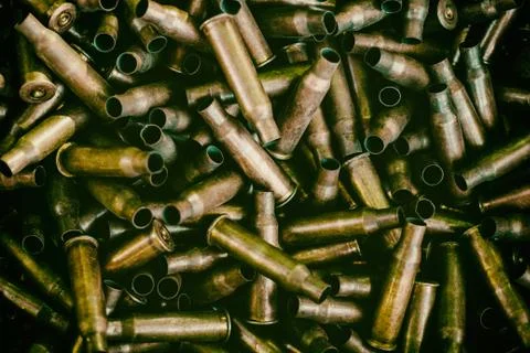 Many empty bullet shells, pile of used rifle cartridges 7.62 mm caliber, assa Stock Photos