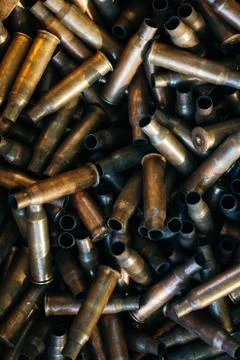 Many empty bullet shells, pile of used rifle cartridges 7.62 mm caliber, assa Stock Photos