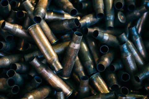 Many empty bullet shells, pile of used rifle cartridges 7.62 mm caliber, assa Stock Photos