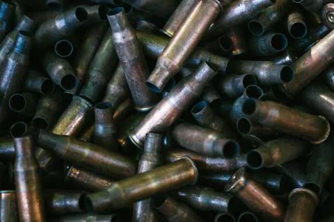 Many empty bullet shells, pile of used rifle cartridges 7.62 mm caliber, assa Stock Photos