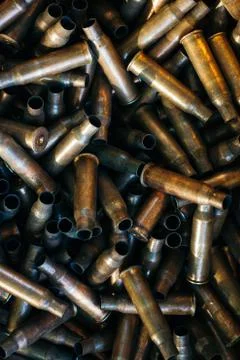 Many empty bullet shells, pile of used rifle cartridges 7.62 mm caliber, assa Stock Photos