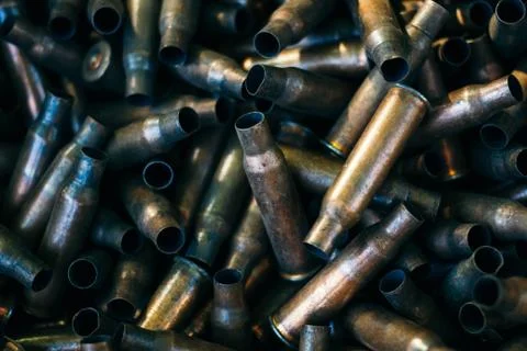 Many empty bullet shells, pile of used rifle cartridges 7.62 mm caliber, assa Stock Photos