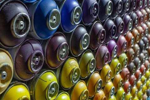 Many empty cylinders of paint for graffiti. Tools for street art Stock Photos