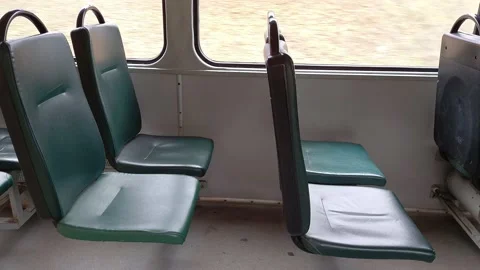 Many empty green seats in a driving tram. Stock Footage 143471107