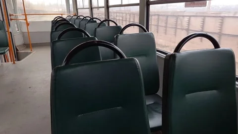 Many empty green seats in a driving tram. Stock Footage 143471678